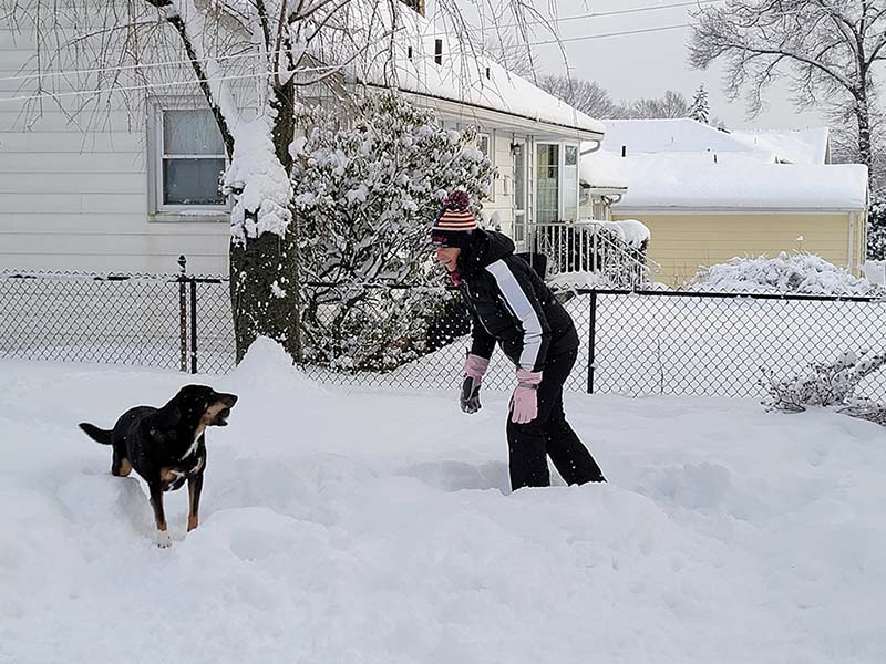 My wife Deb with our dog Bella in the snow